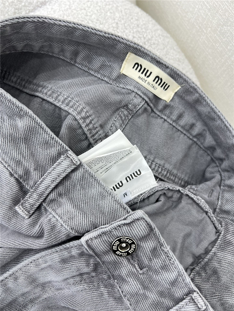 M1um1u waistband letter patch logo embellished jeans