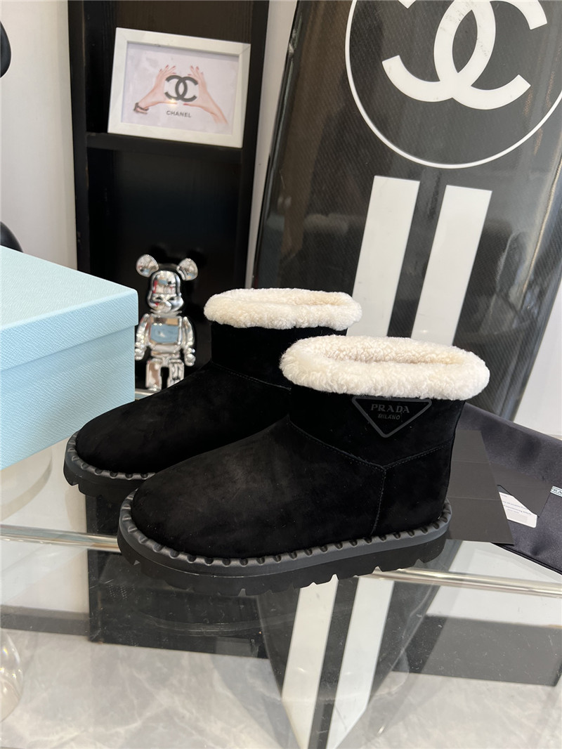 Pra*a triangle-logo suede boots in black