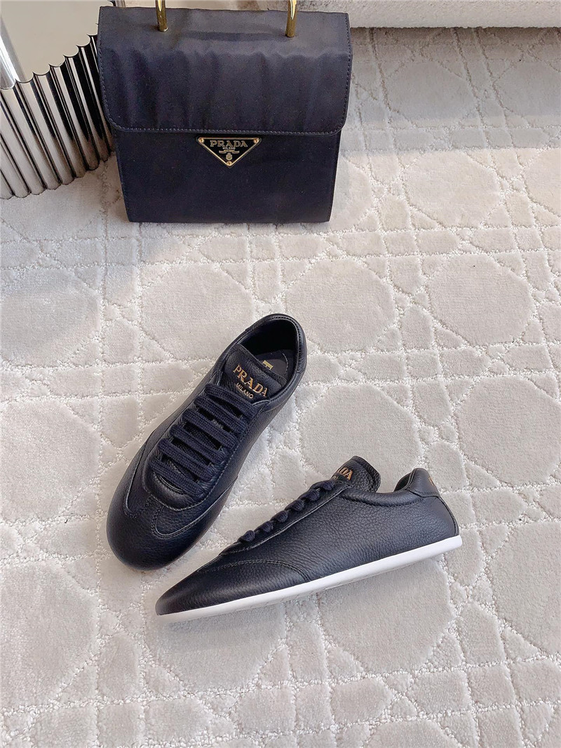 Pra*a triangle logo sneakers in black