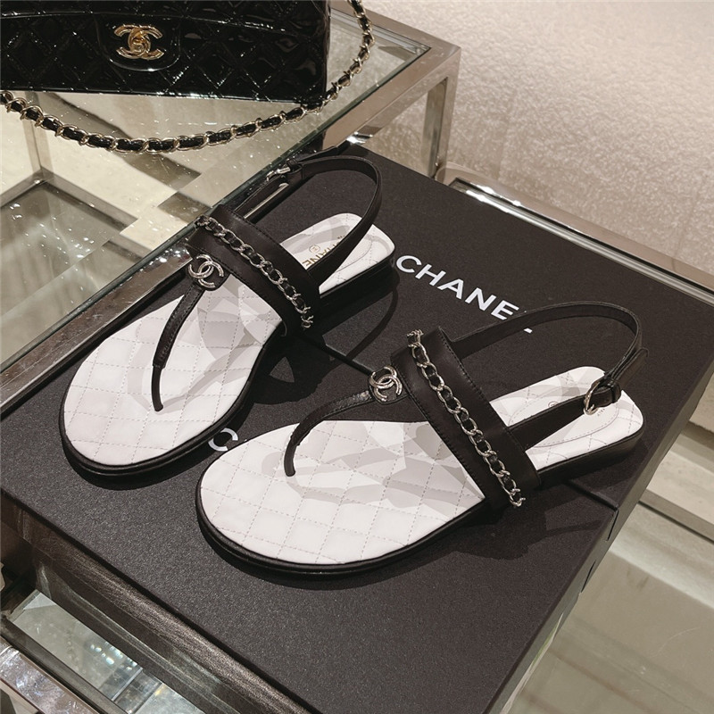 Ch**el quilted t-strap chain flat sandals black and white