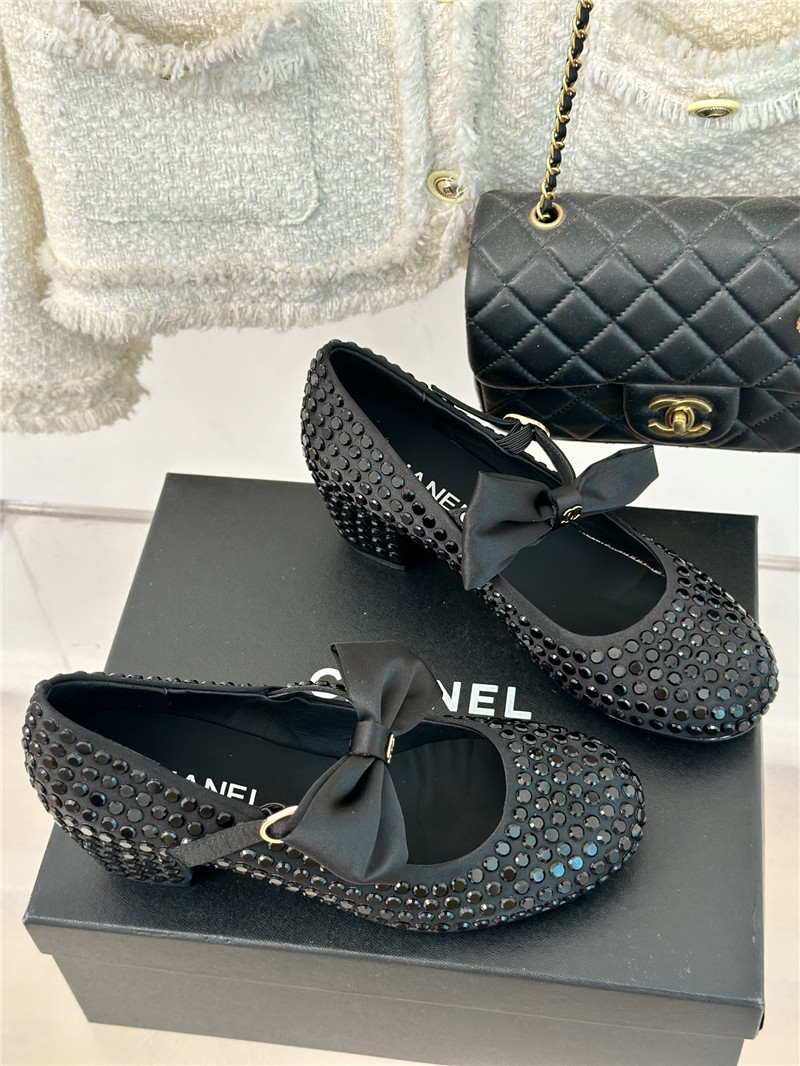 Ch**el bow mary jane sandals in black satin and studs