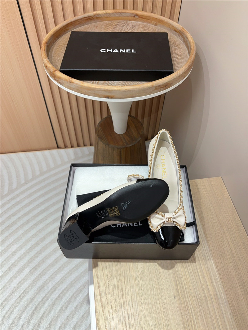 Ch**el bow chain trim ballet pumps in white and black leather