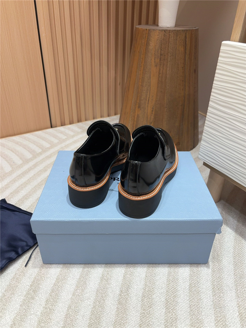 Pra*a black and beige chocolate patent leather loafers
