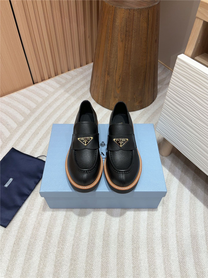 Pra*a black double chocolate leather loafers