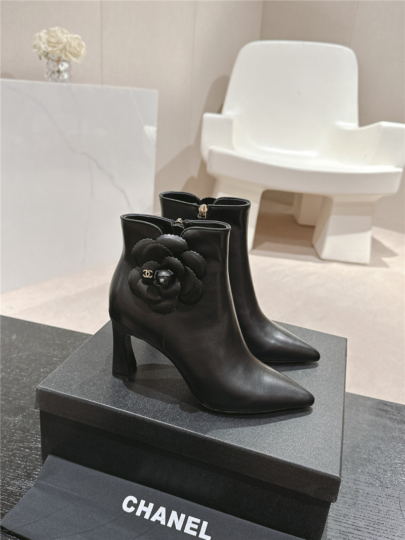 Ch**el heel black calfskin pointed toe boots