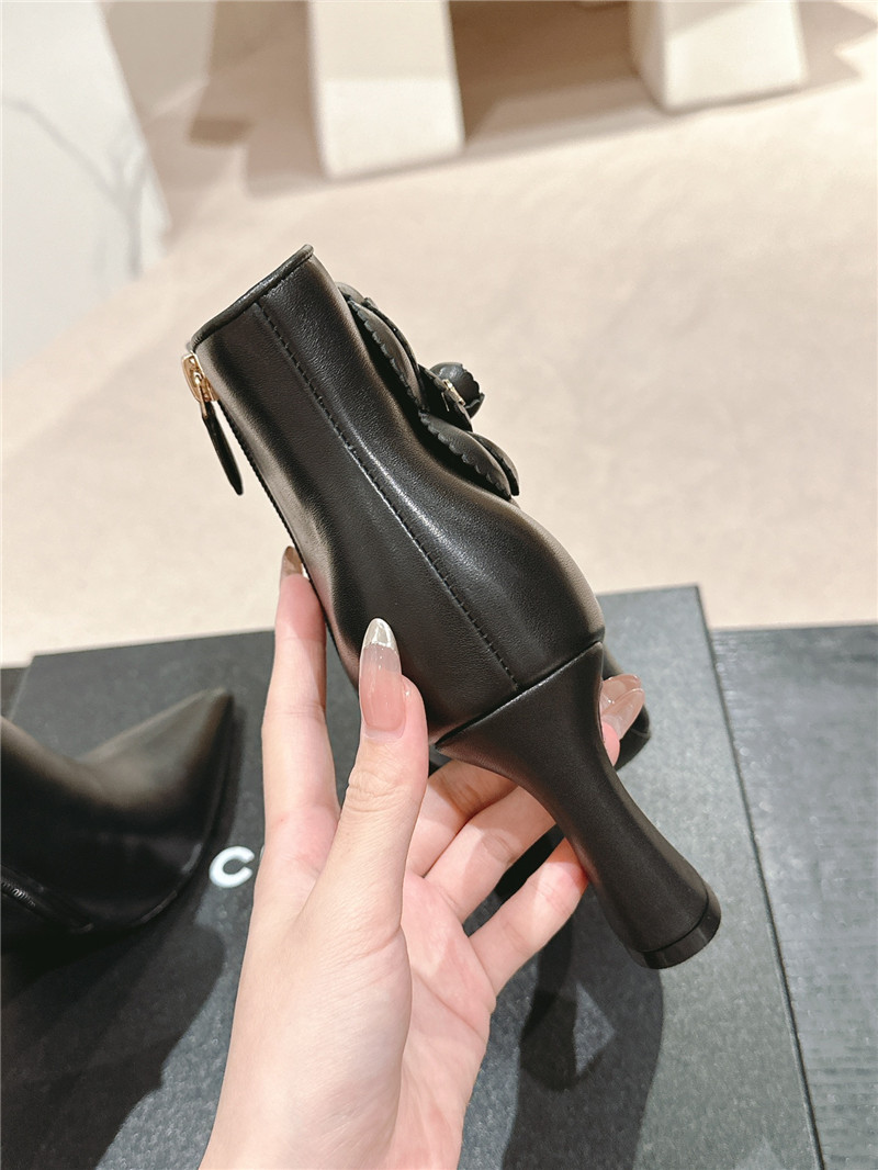 Ch**el heel black calfskin pointed toe boots