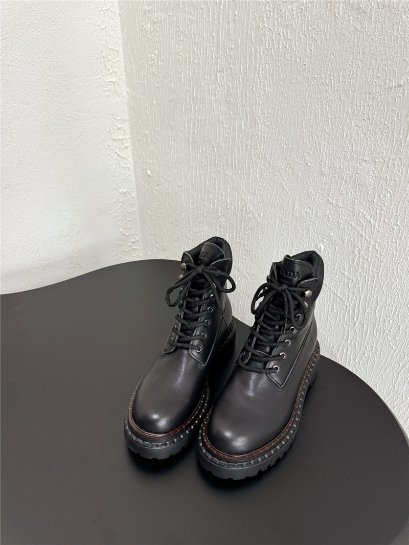 Pra*a black leather and re-nylon booties