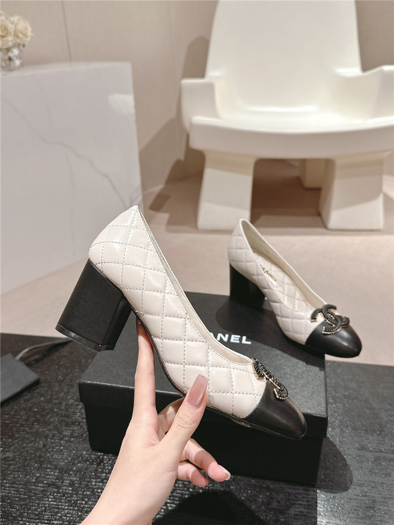 Ch**el white/black quilted leather cap toe pumps