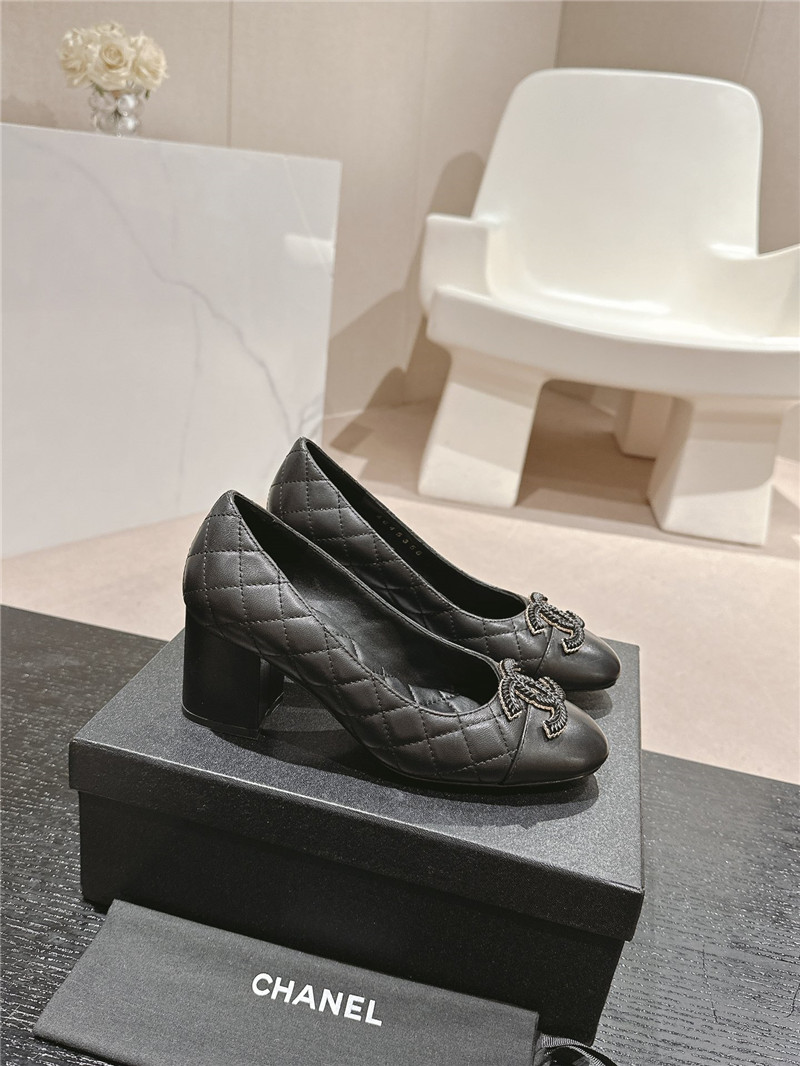 Ch**el black quilted leather cap toe pumps