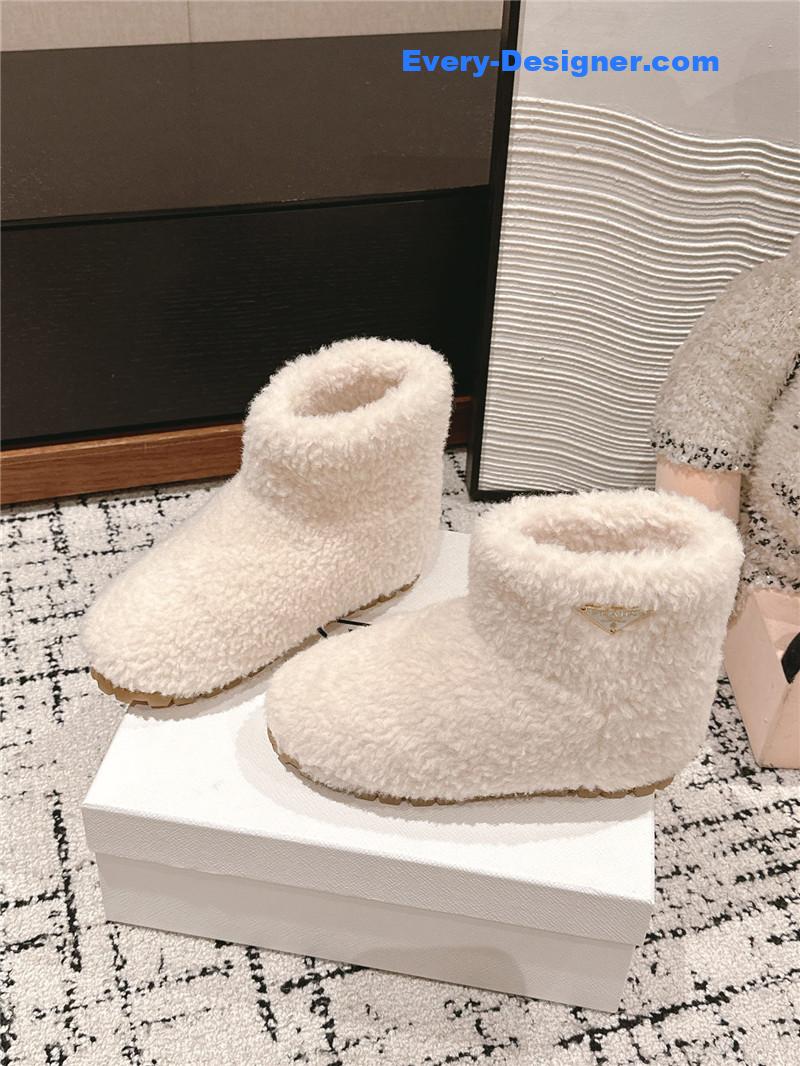 Pra*a white shearling booties