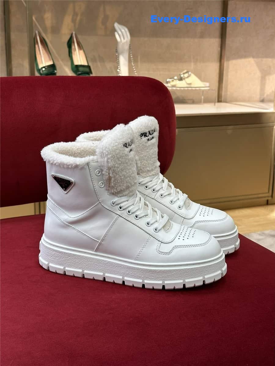 Pra*a white triangle-logo high-top leather sneakers