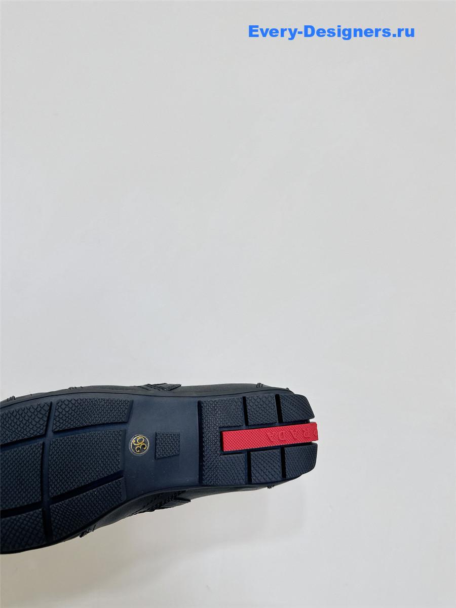 Pra*a black leather low-top sneakers